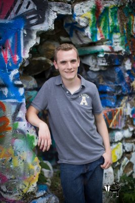 he looks great by the graffiti in new ulm mn senior pictures