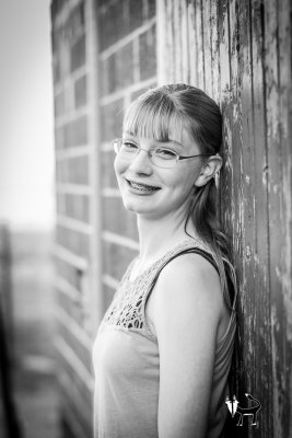 black and white looks awesome by the barn for this girl's senior pictures out on the farm