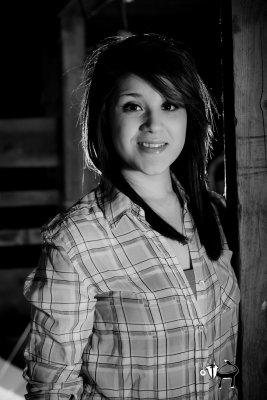 black and white senior photography fashion lighting in a barn